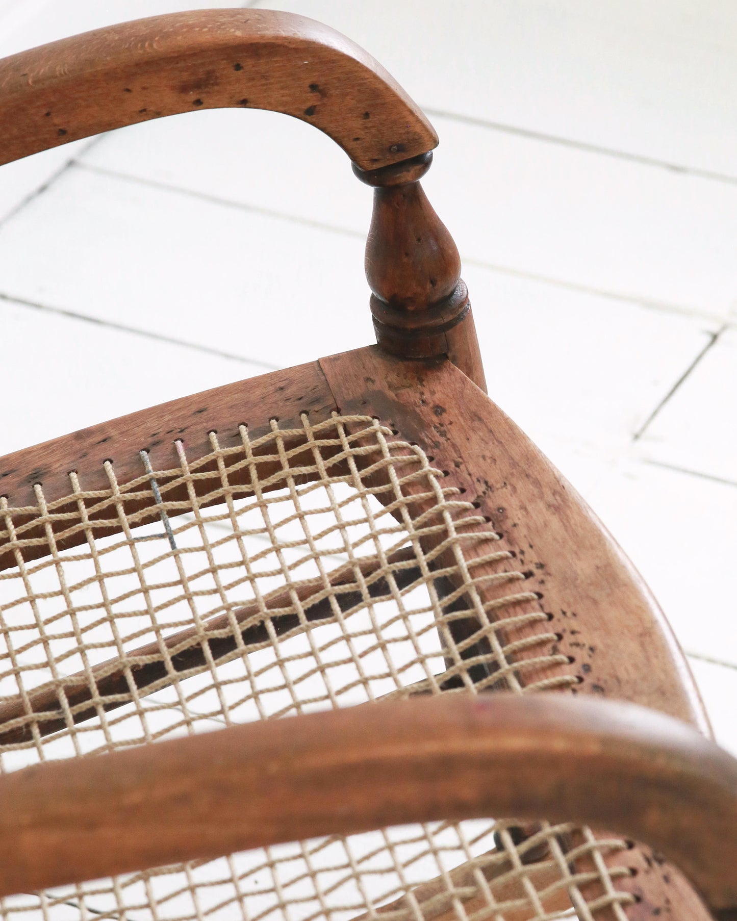 String detail to vintage rocking chair seat