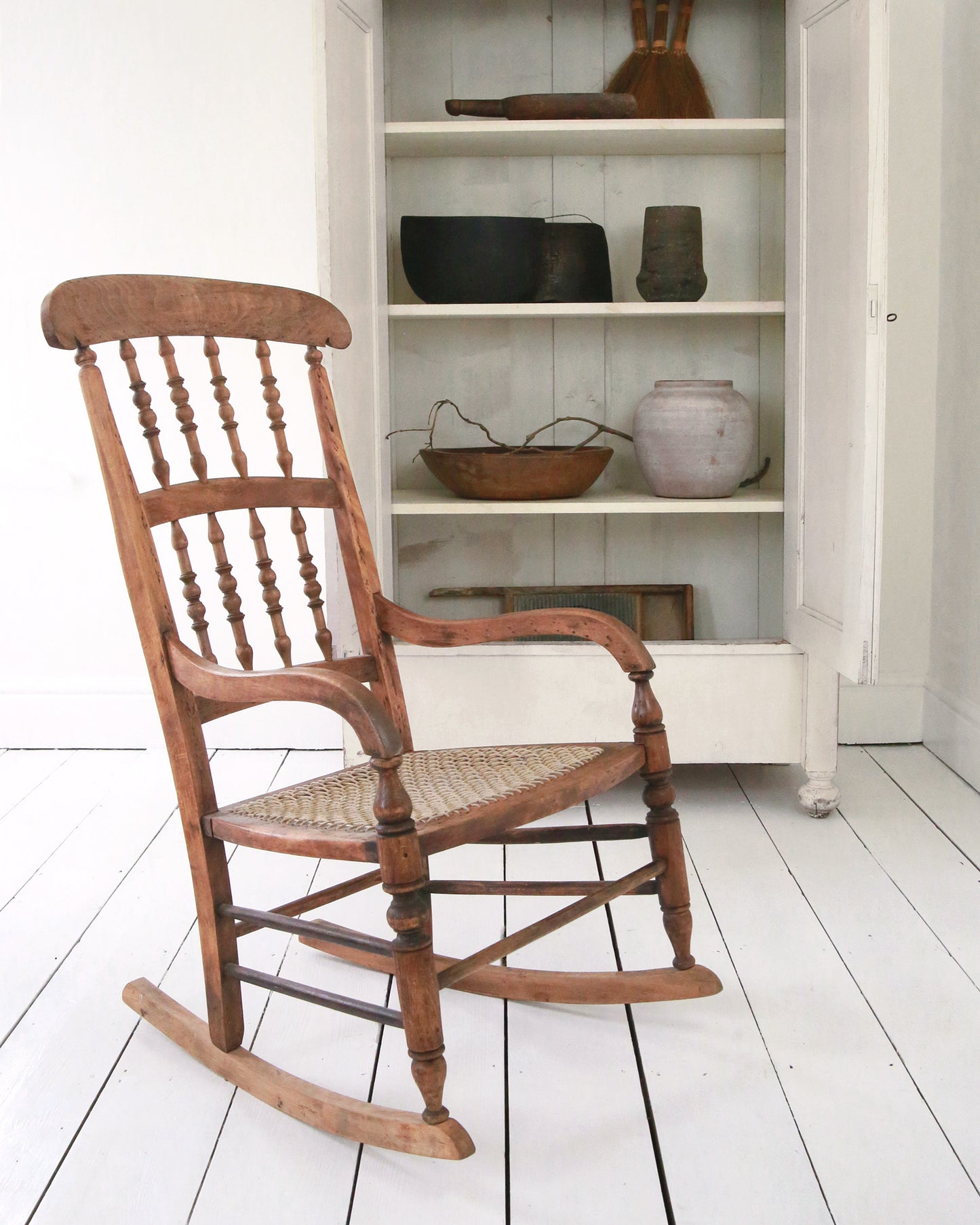Vintage preloved wooden rocking chair in situ